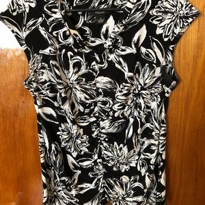 Cute cap sleeve top with ruching down front.